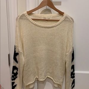 cute sweater with detail on sleeves